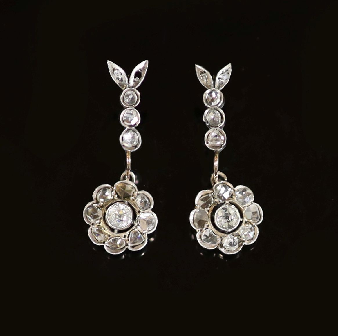 A pair of antique gold, silver old round and rose cut diamond cluster set drop earrings